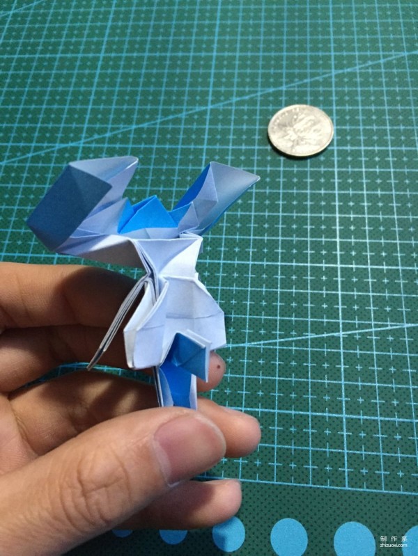 Real-life tutorial on origami Chirulian with complex origami cartoon characters