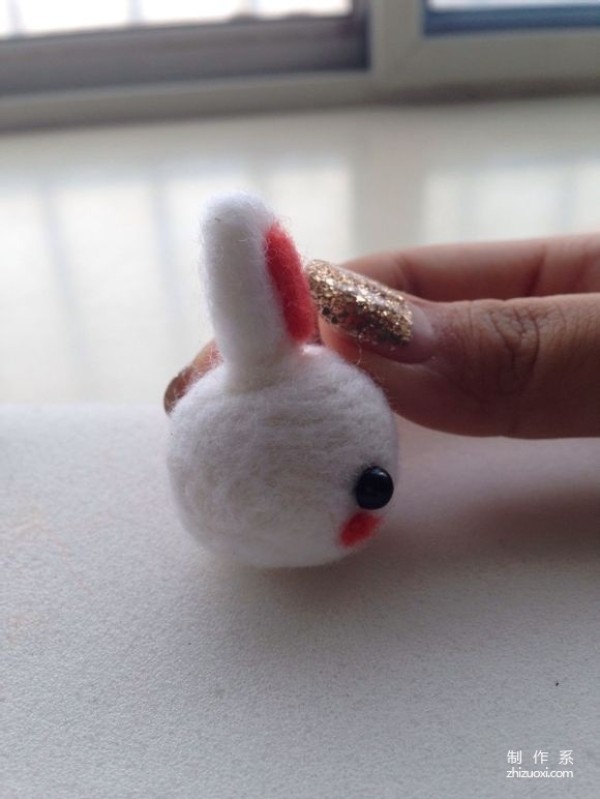 Handmade illustration of cute wool felt bunny pendant