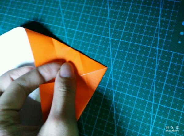 Origami method of folding a paper bird, real-life tutorial on origami of a small kingfisher