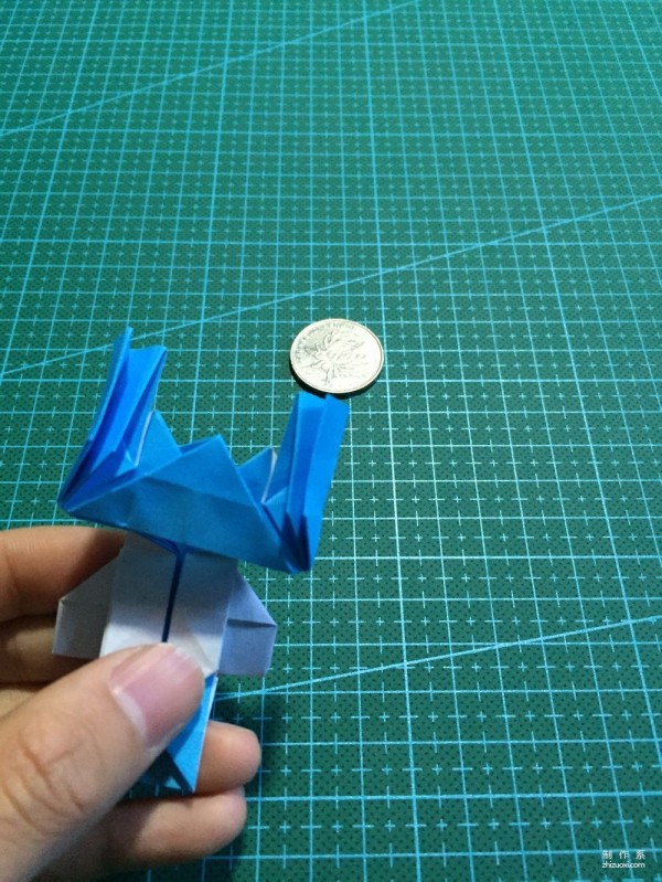 Real-life tutorial on origami Chirulian with complex origami cartoon characters