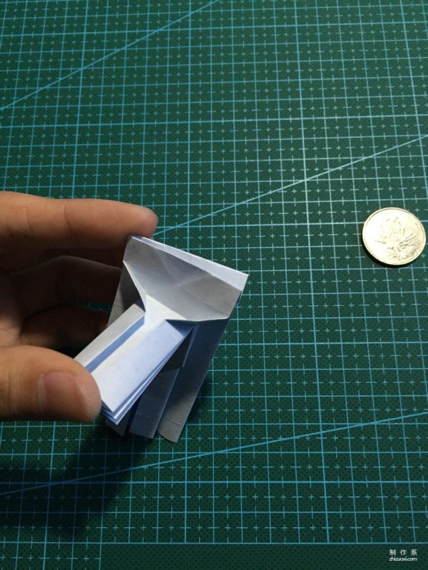 Real-life tutorial on origami Chirulian with complex origami cartoon characters