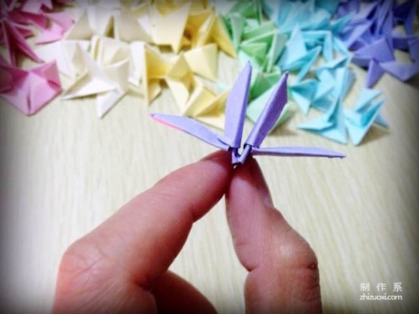 Insert a rainbow heart into a triangle, a tutorial on how to make a beautiful love using origami using a triangle