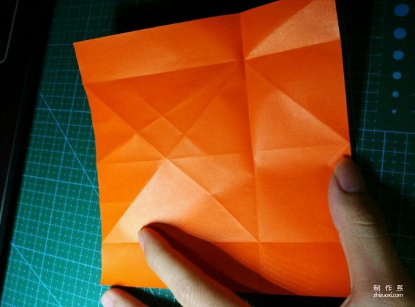 Origami method of folding a paper bird, real-life tutorial on origami of a small kingfisher