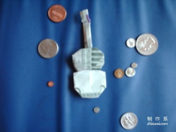 How to make an origami guitar out of dollars Tutorial on how to make an origami guitar out of dollars