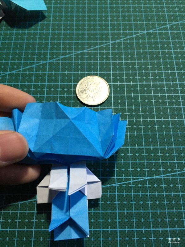 Real-life tutorial on origami Chirulian with complex origami cartoon characters