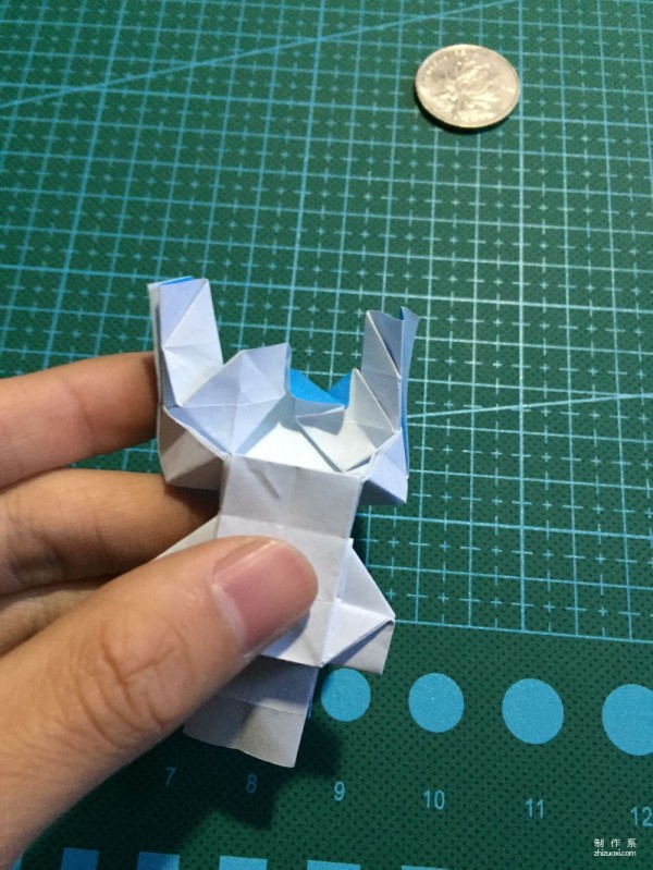 Real-life tutorial on origami Chirulian with complex origami cartoon characters