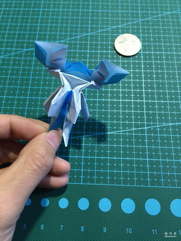 Real-life tutorial on origami Chirulian with complex origami cartoon characters