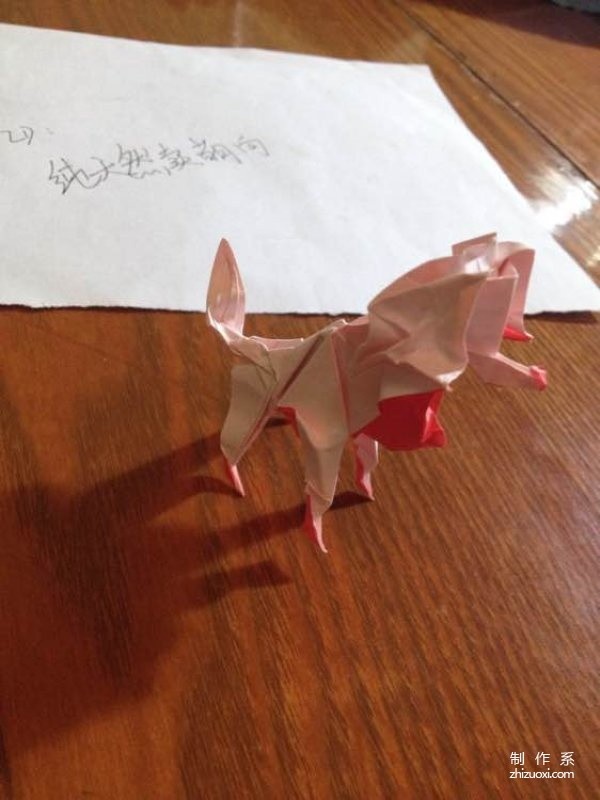 Step-by-step illustrated tutorial on how to make an origami puppy