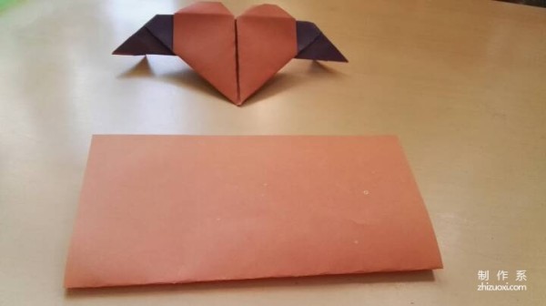 A handmade origami heart with wings - tutorial on how to make origami hearts