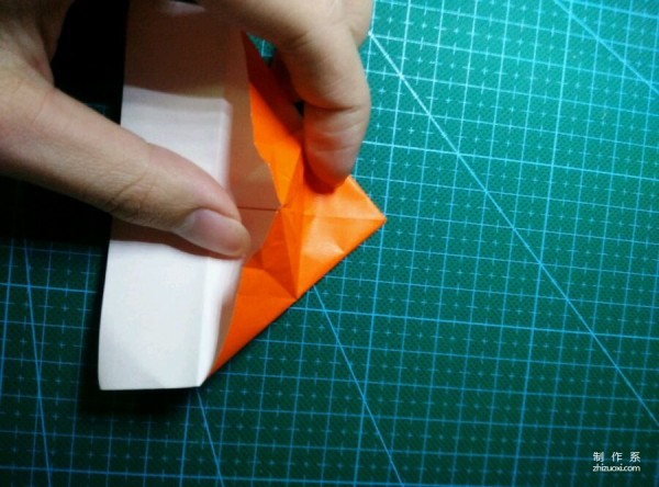 Origami method of folding a paper bird, real-life tutorial on origami of a small kingfisher