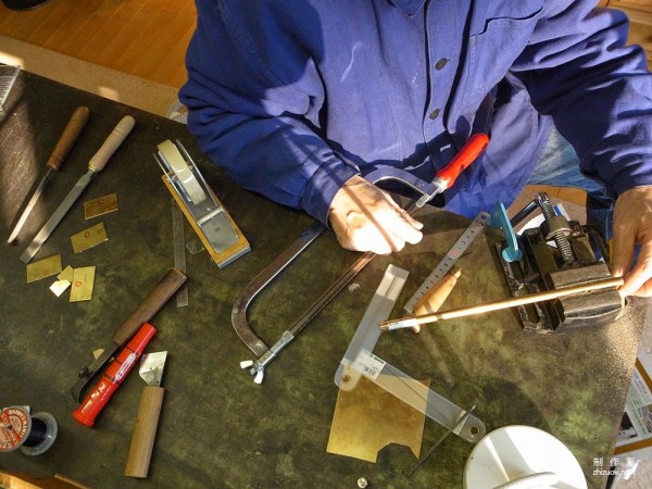 The process of Japanese craftsman Yukihiro Fujii making a leather suitcase based on a wooden box frame