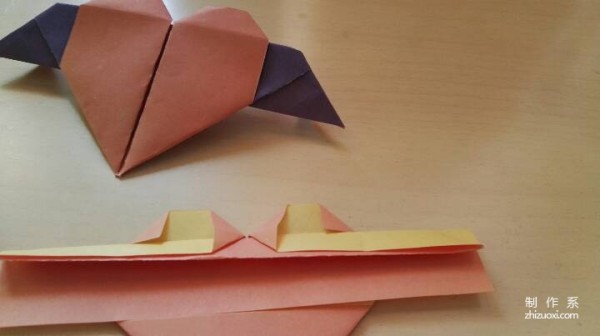 A handmade origami heart with wings - tutorial on how to make origami hearts