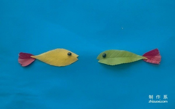 Handmade tutorial on leaf stickers of a pair of fish talking heart-to-heart