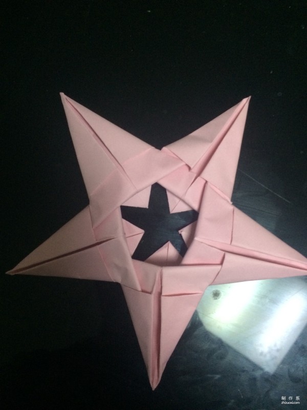 Very simple origami illustration of colored paper five-pointed star