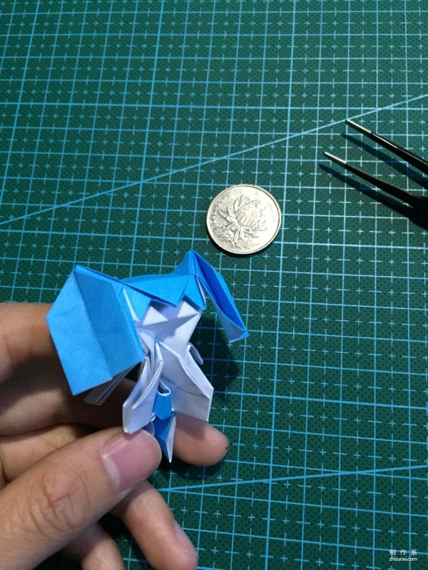 Real-life tutorial on origami Chirulian with complex origami cartoon characters