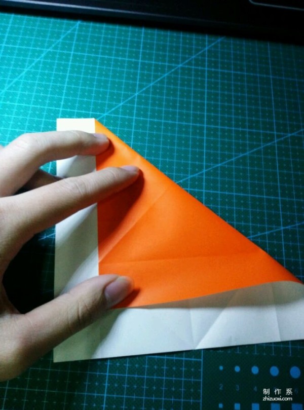 Origami method of folding a paper bird, real-life tutorial on origami of a small kingfisher