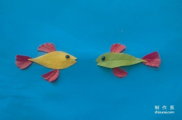 Handmade tutorial on leaf stickers of a pair of fish talking heart-to-heart