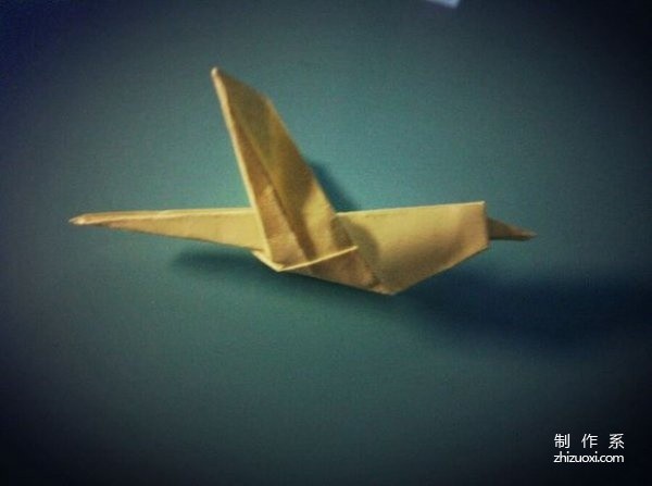 Illustrated step-by-step origami tutorial for folding a cute little hummingbird.