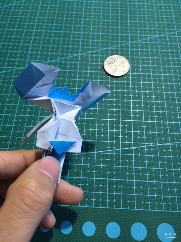 Real-life tutorial on origami Chirulian with complex origami cartoon characters