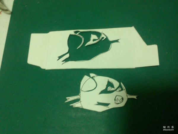 Simple and practical method of making handmade paper-cut Black Super Pig Superman bookmark