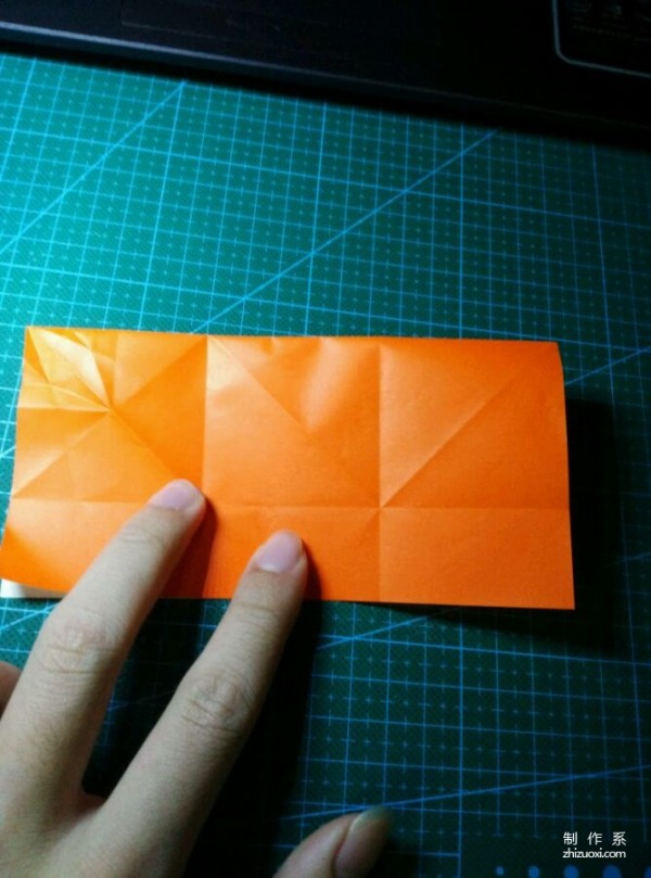 Origami method of folding a paper bird, real-life tutorial on origami of a small kingfisher