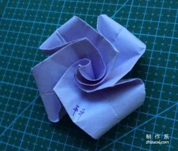 Tutorial on how to fold super simple rose origami from purple colored paper