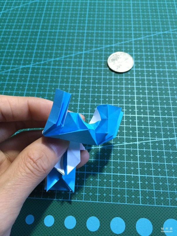 Real-life tutorial on origami Chirulian with complex origami cartoon characters