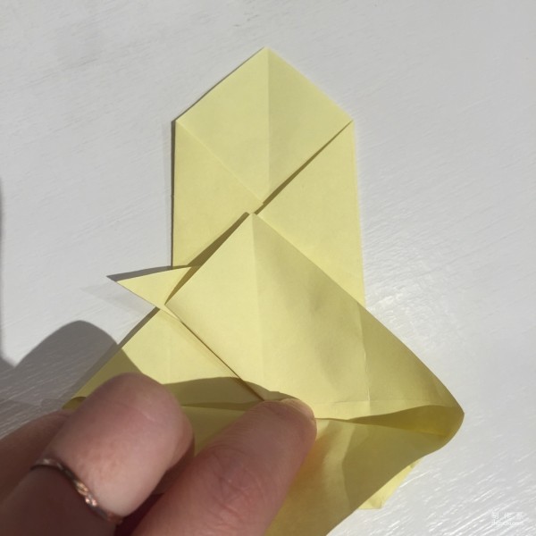 Detailed step-by-step illustration of creative origami for chicken red envelope