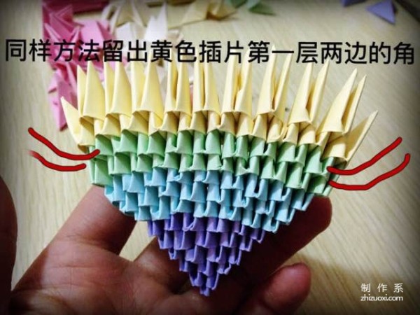 Insert a rainbow heart into a triangle, a tutorial on how to make a beautiful love using origami using a triangle