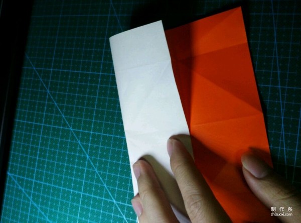 Origami method of folding a paper bird, real-life tutorial on origami of a small kingfisher