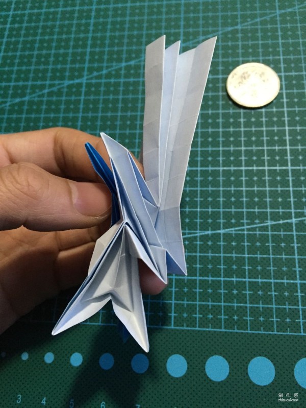 Real-life tutorial on origami Chirulian with complex origami cartoon characters