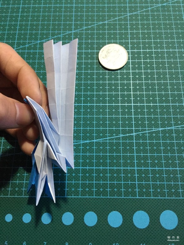 Real-life tutorial on origami Chirulian with complex origami cartoon characters